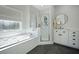 Bright bathroom showcases a large soaking tub, walk-in shower, and modern finishes at 3075 Maritime Forest Dr, Johns Island, SC 29455