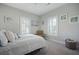 Bright bedroom with shuttered windows, soft carpet and a neutral palette creates a serene space at 3075 Maritime Forest Dr, Johns Island, SC 29455