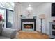 Living room fireplace with mantel and hearth featuring mosaic tile surround and gas logs at 3075 Maritime Forest Dr, Johns Island, SC 29455