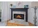 Living room fireplace with mantel and hearth featuring mosaic tile surround and gas logs at 3075 Maritime Forest Dr, Johns Island, SC 29455