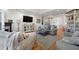 Cozy living room with a fireplace, plush seating, and hardwood floors at 3075 Maritime Forest Dr, Johns Island, SC 29455