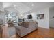 Bright living room features a fireplace, hardwood floors, and a vaulted ceiling with fan at 3075 Maritime Forest Dr, Johns Island, SC 29455