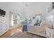 Light-filled main bedroom boasts a plush rug, large bed, and access to outdoor balcony at 3075 Maritime Forest Dr, Johns Island, SC 29455