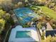 Aerial view of tennis courts and a pool in a beautiful community with lush landscaping at 3075 Maritime Forest Dr, Johns Island, SC 29455