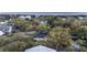 This aerial shows a beautiful neighborhood with mature trees and diverse homes near the coastline at 3304 Hartnett Blvd, Isle of Palms, SC 29451