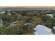 Breathtaking aerial view of a beautiful neighborhood near the ocean, showcasing the lush landscaping and serene setting at 3304 Hartnett Blvd, Isle of Palms, SC 29451
