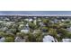 This aerial view shows a neighborhood close to the beach, featuring lush greenery and diverse homes at 3304 Hartnett Blvd, Isle of Palms, SC 29451
