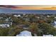 Stunning aerial view of a coastal community with beautiful homes and mature trees, leading to the ocean at 3304 Hartnett Blvd, Isle of Palms, SC 29451