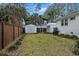 Spacious backyard with a shed, green grass, and mature trees providing ample shade at 3304 Hartnett Blvd, Isle of Palms, SC 29451