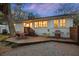 Backyard features a charming deck with dining set, grill, and a well-maintained yard, perfect for outdoor entertaining at 3304 Hartnett Blvd, Isle of Palms, SC 29451