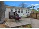 Backyard view with wooden deck, outdoor dining set, grill, and ample space perfect for outdoor entertaining and relaxation at 3304 Hartnett Blvd, Isle of Palms, SC 29451