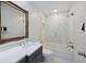 Modern bathroom featuring a glass shower, soaking tub, and stylish vanity at 3304 Hartnett Blvd, Isle of Palms, SC 29451
