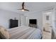 Bright bedroom featuring coastal decor, ceiling fan and ensuite bathroom for comfortable living at 3304 Hartnett Blvd, Isle of Palms, SC 29451