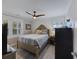 Bright and cozy bedroom with a ceiling fan, natural light and plank flooring at 3304 Hartnett Blvd, Isle of Palms, SC 29451