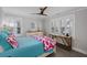 Bright bedroom with white trim, natural light, and a ceiling fan at 3304 Hartnett Blvd, Isle of Palms, SC 29451