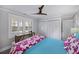 Bright bedroom featuring ceiling fan, dual closet and view of exterior shutters at 3304 Hartnett Blvd, Isle of Palms, SC 29451