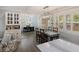 Eat-in kitchen area featuring rustic table, light fixture and view of office at 3304 Hartnett Blvd, Isle of Palms, SC 29451