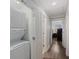 Hallway with a stacked washer and dryer unit conveniently located near other rooms at 3304 Hartnett Blvd, Isle of Palms, SC 29451
