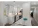 Beautiful kitchen with stainless steel appliances, white cabinetry, and white marble countertops at 3304 Hartnett Blvd, Isle of Palms, SC 29451