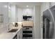 Bright kitchen with stainless steel appliances and white cabinets at 3304 Hartnett Blvd, Isle of Palms, SC 29451