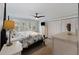Comfortable main bedroom with a ceiling fan, shutters, and natural light at 3304 Hartnett Blvd, Isle of Palms, SC 29451