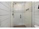 This luxurious bathroom features a glass door shower with white tiled walls and a mosaic accent stripe at 3304 Hartnett Blvd, Isle of Palms, SC 29451
