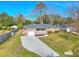 Stunning aerial capturing a beautiful brick home with an attached garage and a lush green yard at 3552 Old Ferry Rd, Johns Island, SC 29455