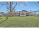 Expansive backyard with lush green grass, mature trees, and plenty of space for outdoor activities at 3552 Old Ferry Rd, Johns Island, SC 29455
