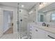 Stylish bathroom featuring a tiled shower with glass door, and a marble vanity at 3552 Old Ferry Rd, Johns Island, SC 29455