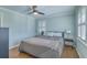 Cozy bedroom featuring hardwood floors, a ceiling fan, and light blue colored walls and trim at 3552 Old Ferry Rd, Johns Island, SC 29455