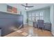 Bedroom with a wall bed system, ceiling fan, hardwood floors, and home office workspace at 3552 Old Ferry Rd, Johns Island, SC 29455