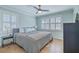 Bright bedroom with large windows, hardwood floors, a ceiling fan, and a comfortable bed at 3552 Old Ferry Rd, Johns Island, SC 29455