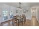 Open dining room with french doors to the porch and view to the hallway at 3552 Old Ferry Rd, Johns Island, SC 29455