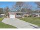 Well-maintained single-story home with a garage, front porch, and green lawn at 3552 Old Ferry Rd, Johns Island, SC 29455
