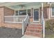 Charming front porch with a ceiling fan and brick stairs at 3552 Old Ferry Rd, Johns Island, SC 29455