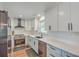 Modern kitchen featuring sleek white cabinetry, stainless steel appliances, and quartz countertops at 3552 Old Ferry Rd, Johns Island, SC 29455