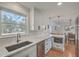 Kitchen with white cabinetry, stainless steel appliances, and undermount sink at 3552 Old Ferry Rd, Johns Island, SC 29455