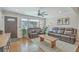 Cozy living room with hardwood floors, comfortable furniture, and ample natural light at 3552 Old Ferry Rd, Johns Island, SC 29455