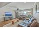 Inviting living room with comfortable leather seating, a ceiling fan, and plenty of natural light at 3552 Old Ferry Rd, Johns Island, SC 29455