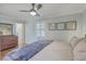 Main bedroom with ceiling fan, light blue walls and framed art at 3552 Old Ferry Rd, Johns Island, SC 29455