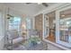 Bright sunroom with view of the backyard and access to the indoor dining room at 3552 Old Ferry Rd, Johns Island, SC 29455