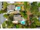 Aerial view of a well-maintained home featuring a private pool, lush landscaping, and a peaceful setting at 4029 Cascades Thrust, Summerville, SC 29483