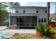 Spacious backyard features a screened porch, brick stairs and patio with outdoor seating at 4029 Cascades Thrust, Summerville, SC 29483