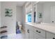 Bathroom features a full sink and cabinet, toilet, and a view outside the window at 4029 Cascades Thrust, Summerville, SC 29483