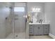 A well-lit bathroom showcasing a glass shower with built-in shelving and a modern vanity at 4029 Cascades Thrust, Summerville, SC 29483