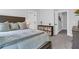 Cozy bedroom features a wood headboard, soft bedding, and convenient storage shelves at 4029 Cascades Thrust, Summerville, SC 29483