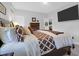 Bedroom features a TV, large comfortable bed, neutral colored walls, and a doorway to another room at 4029 Cascades Thrust, Summerville, SC 29483
