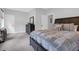 Spacious bedroom featuring neutral colored walls, dark wood furniture, and a large bed at 4029 Cascades Thrust, Summerville, SC 29483