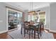 Dining room with backyard view, wood table, seating for six and access to a screen porch at 4029 Cascades Thrust, Summerville, SC 29483