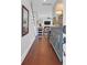 Open foyer featuring hardwood floors, decorative furniture, and a glimpse of the living room beyond at 4029 Cascades Thrust, Summerville, SC 29483